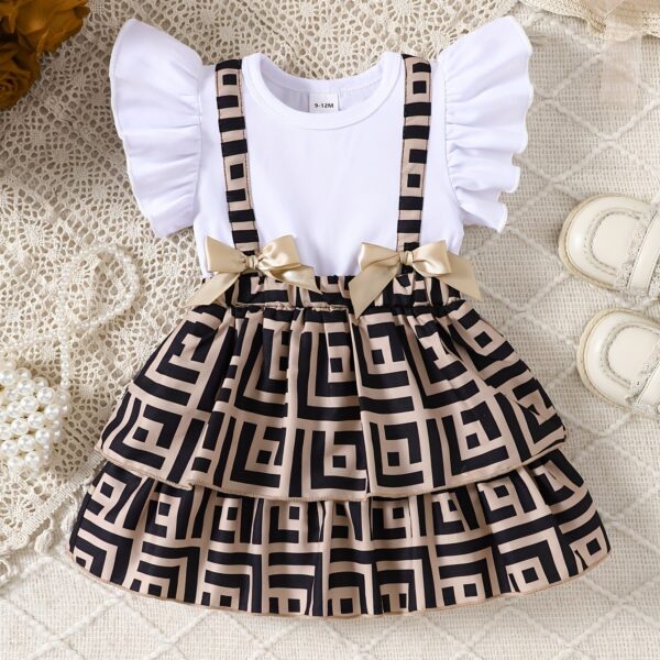 Baby girl wearing a charming two-tone plaid summer dress, perfect for playtime.